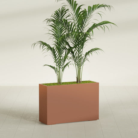 Potsdam Corner fiberglass planter in Matte Terra Cotta, shown planted, in a sunlit interior