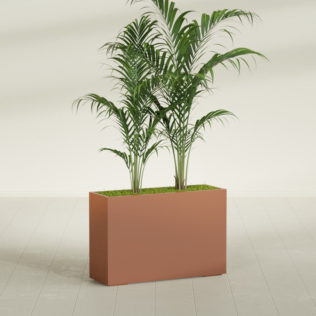 Potsdam Rectangular fiberglass planter in Matte Terra Cotta, shown planted, in a sunlit interior