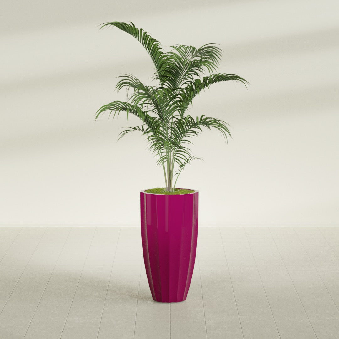 San Jose Tall Fluted fiberglass planter in Gloss Eggplant, shown planted, in a sunlit interior