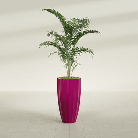 San Jose Tall Fluted fiberglass planter in Gloss Eggplant, shown planted, in a sunlit interior