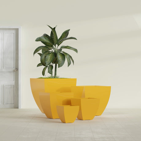 Lima Tapered Square fiberglass planter in Gloss Saffron, size range, in a sunlit interior