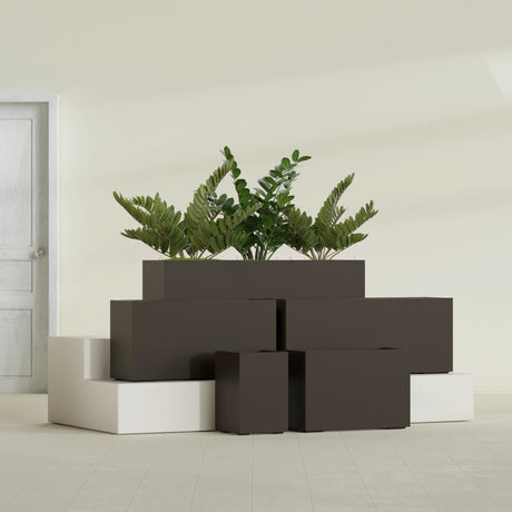 Tolga Corner fiberglass planter in Matte Dark Brown, size range, in a sunlit interior