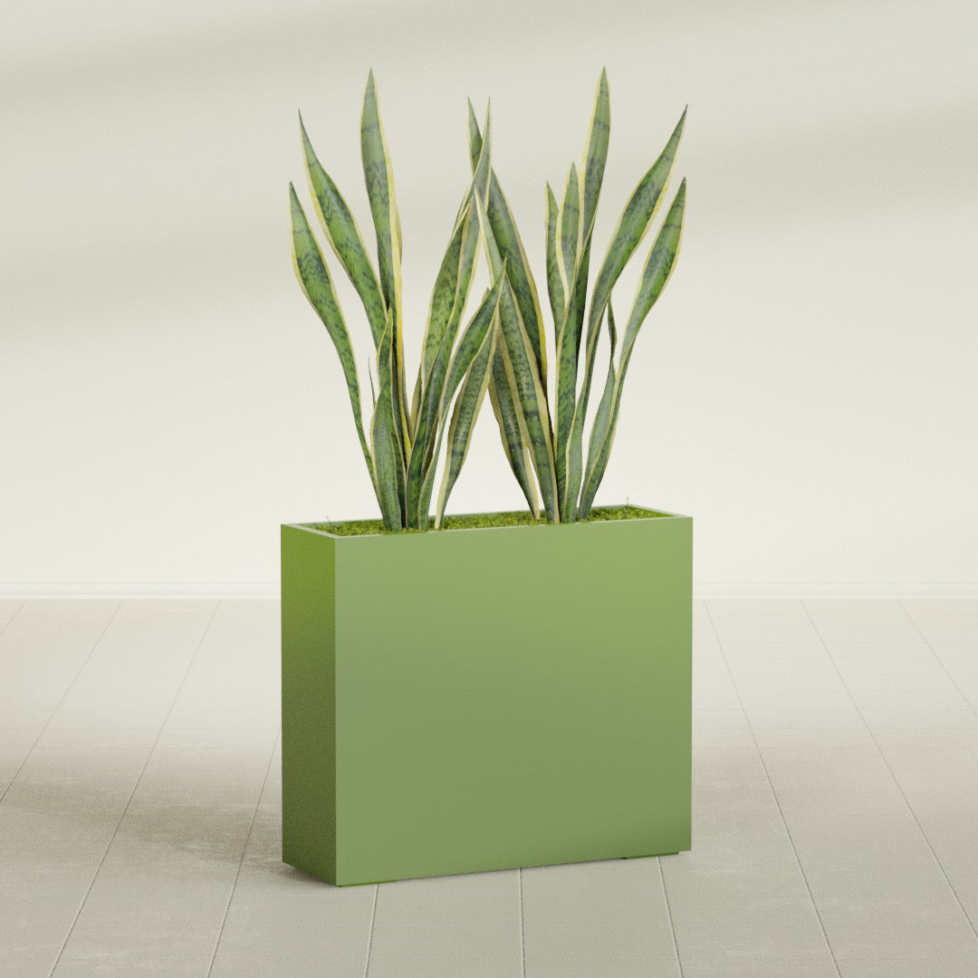 Perth Corner fiberglass planter in Satin Green, shown planted, in a sunlit interior