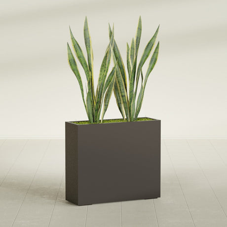 Perth Corner fiberglass planter in Matte Dark Brown, shown planted, in a sunlit interior