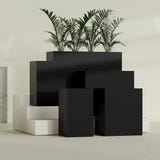 Darwin Rectangular fiberglass planter in Matte Black, size range, in a sunlit interior