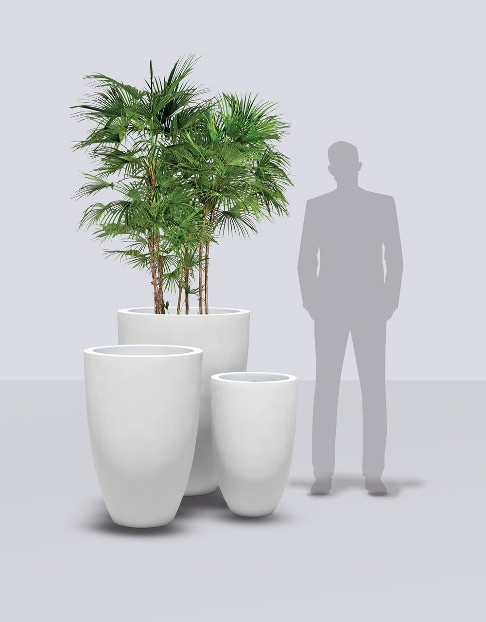Brannan Tapered Round fiberglass planter size range shown to scale beside a standing figure