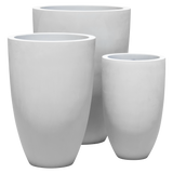 Brannan tapered round fiberglass planter shown in all sizes side by side in a studio render for comparing sizes: D 18 in × 29 in, D 24 in × 35 in, D 30 in × 41 in