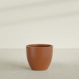 Wannsee Round Planter in Matte Terra Cotta, 39"D × 34"H, shown empty