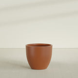 Wannsee Round Planter in Matte Terra Cotta, 39"D × 34"H, shown empty