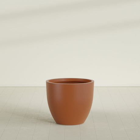 Wannsee Round Planter in Matte Terra Cotta, 39"D × 34"H, shown empty