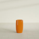 Lisbon tall round tapered fiberglass planter in Gloss Tangerine, 14 in diameter, 25 in high, shown empty
