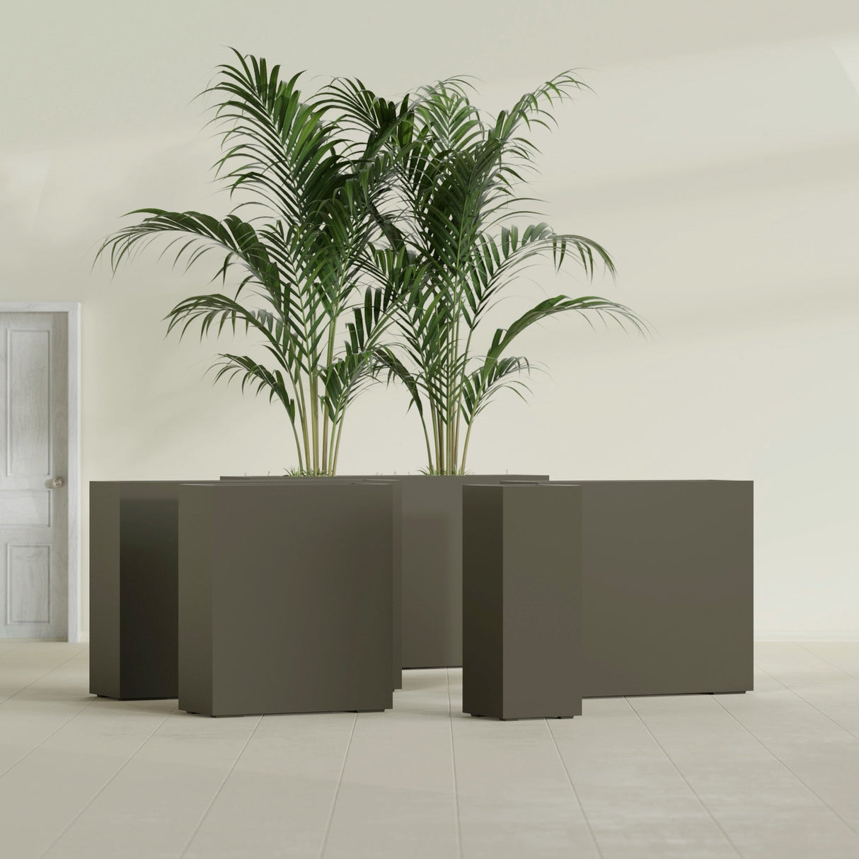 Perth Corner fiberglass planter in Matte Bronze, size range, in a sunlit interior