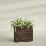Sedona Tall planter in textured walnut, shown planted, in a sunlit interior