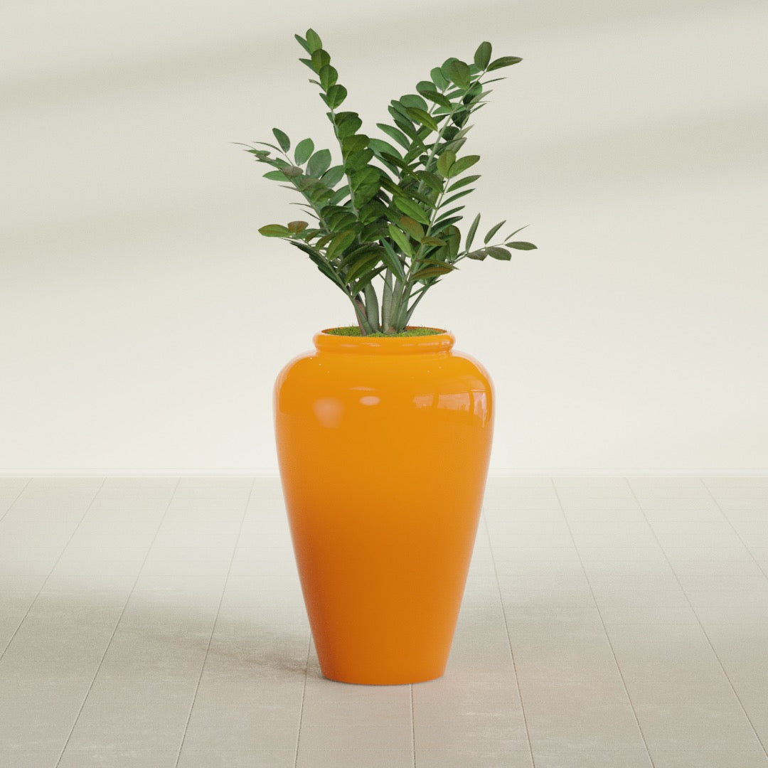 Barà Jar fiberglass planter in Gloss Tangerine, shown planted, in a sunlit interior