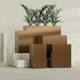 Darwin Rectangular fiberglass planter in Metallic Bronze, size range, in a sunlit interior