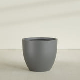 Wannsee Round Planter in Matte Gunmetal, 50"D × 44"H, shown empty
