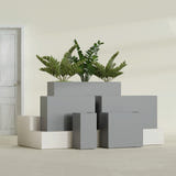 Potsdam Rectangular fiberglass planter in Matte Gunmetal, size range, in a sunlit interior