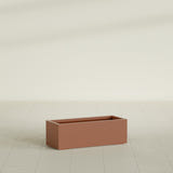 Cuba Low Rectangular Planter in Matte Terra Cotta, 36"L × 14"D × 12"H, shown empty