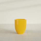 Valencia Tapered Round Planter in Gloss Saffron, 20"D × 23"H, shown empty