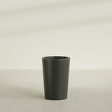 Tegel Round Tapered Planter in Matte Charcoal, 18"D × 26"H, shown empty
