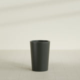 Tegel Round Tapered Planter in Matte Charcoal, 18"D × 26"H, shown empty