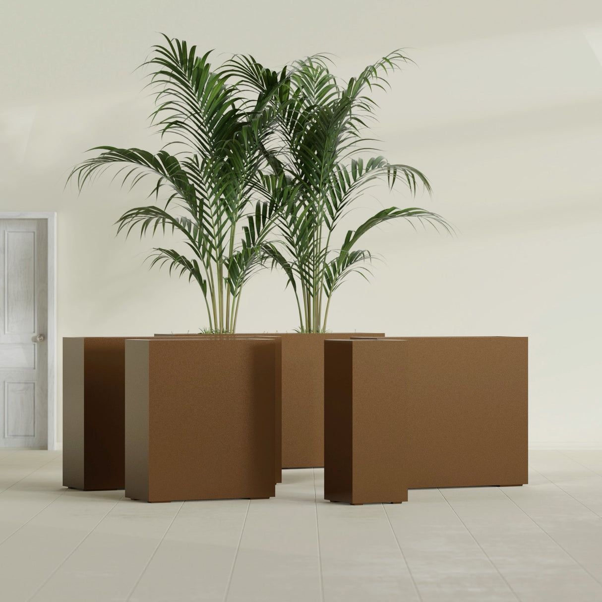 Perth Corner fiberglass planter in Metallic Bronze, size range, in a sunlit interior