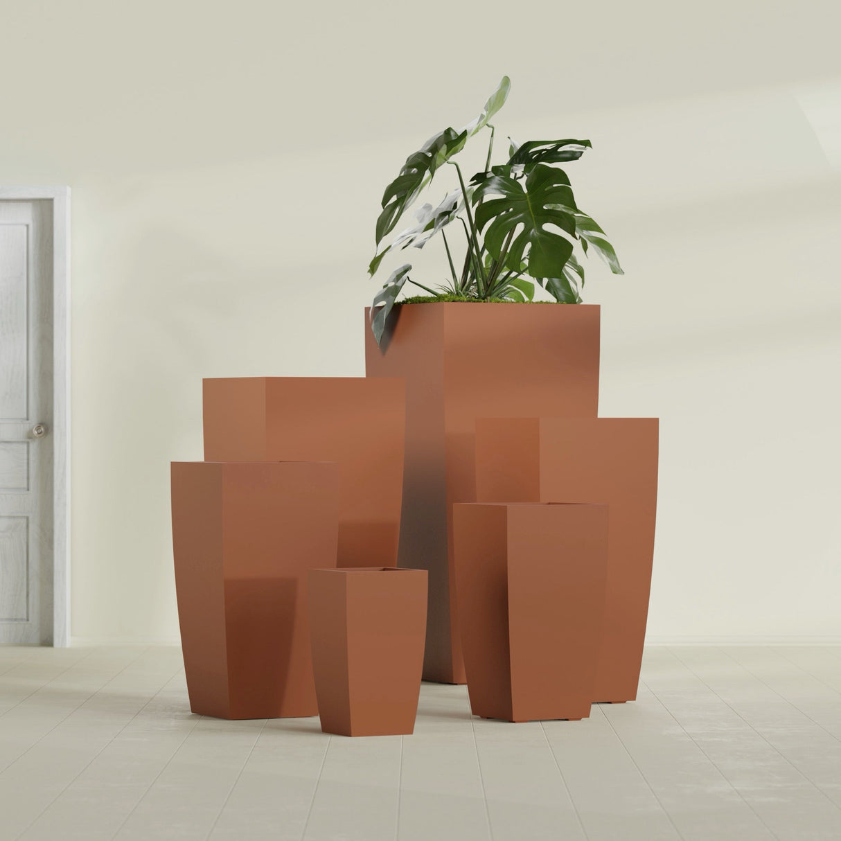 Toulan Tapered Square fiberglass planter in Matte Terra Cotta, size range, in a sunlit interior