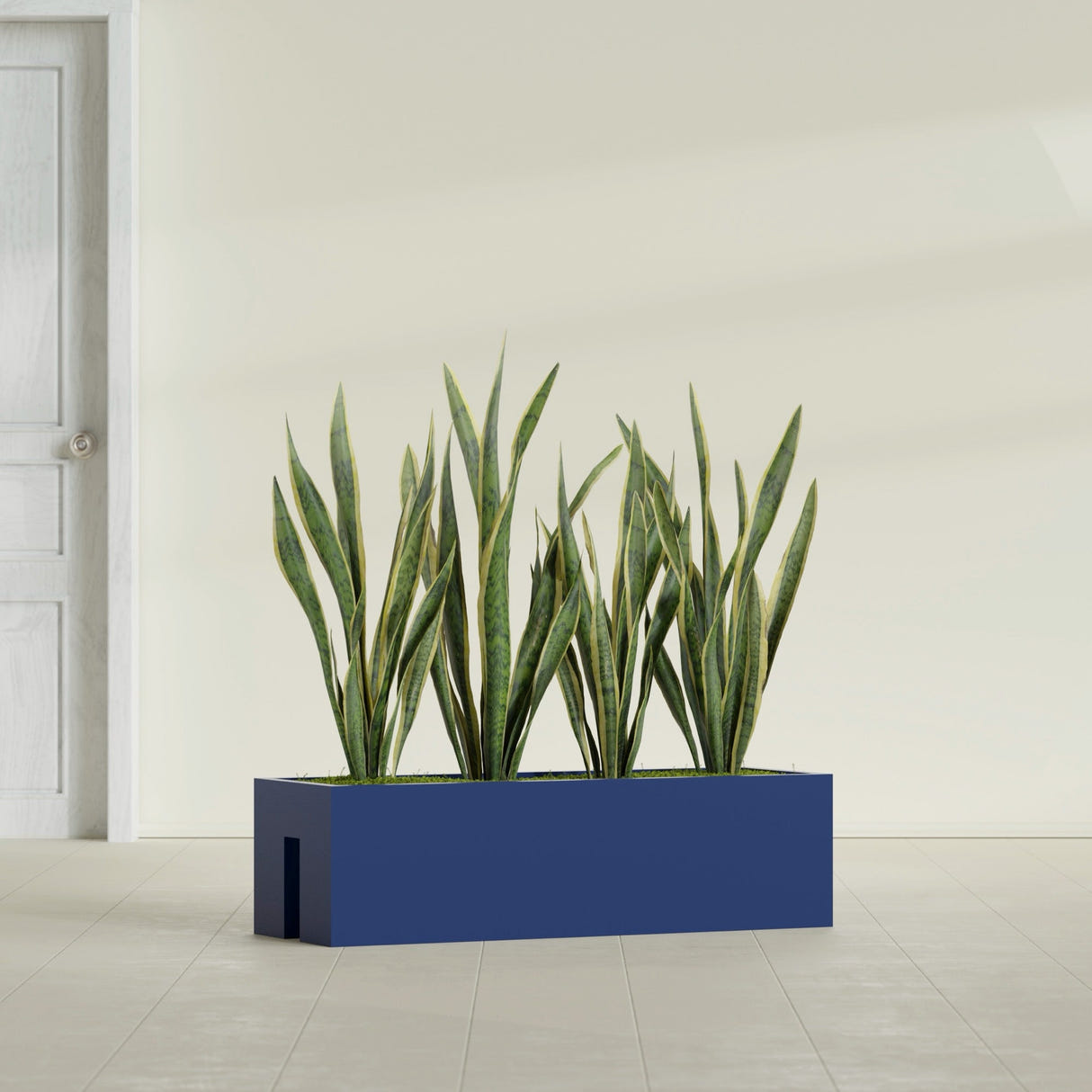 Tiergarden Railing fiberglass planter in Matte Cobalt Blue, shown planted, in a sunlit interior