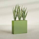 Delray Corner fiberglass planter in Satin Green, shown planted, in a sunlit interior
