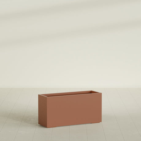 Tolga Rectangular Planter in Matte Terra Cotta, 48"L × 16"D × 24"H, shown empty