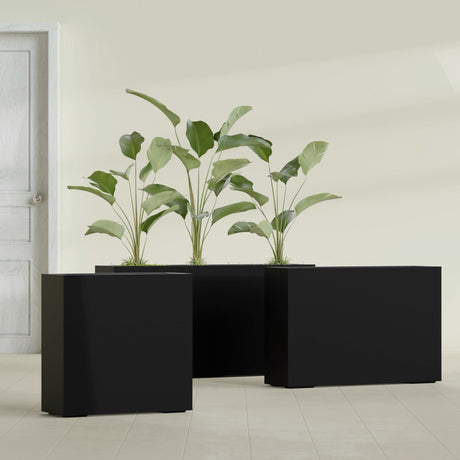 Milano Narrow Rectangular fiberglass planter in Matte Black, shown planted, in a sunlit interior