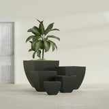 Lima Tapered Square fiberglass planter in Matte Charcoal, size range, in a sunlit interior