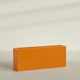 Hollywood Narrow Rectangular Planter in Gloss Tangerine, 60"L × 12"D × 24"H, shown empty