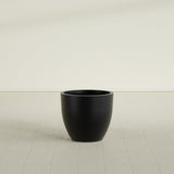 Wannsee Round Planter in Matte Black, 27"D × 24"H, shown empty