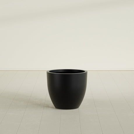 Wannsee Round Planter in Matte Black, 27"D × 24"H, shown empty