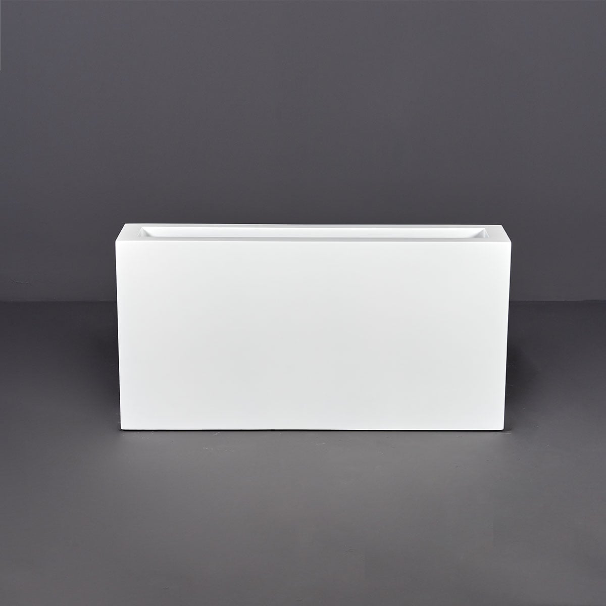 Camoux narrow rectangular fiberglass planter, shown empty, front view