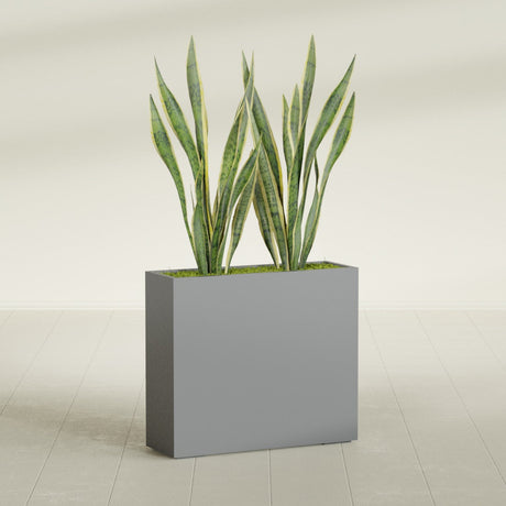 Perth Corner fiberglass planter in Matte Gunmetal, shown planted, in a sunlit interior