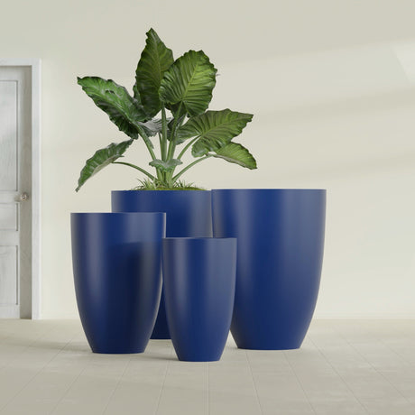 Brannan Tapered Round fiberglass planter in Matte Cobalt Blue, size range, in a sunlit interior