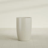 Lisbon tall round tapered fiberglass planter in Satin Beige, 24 in diameter, 36 in high, shown empty