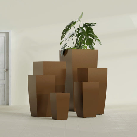 Toulan Tapered Square fiberglass planter in Metallic Bronze, size range, in a sunlit interior