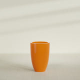 Brannan Tapered Round Planter in Gloss Tangerine, 24"D × 35"H, shown empty