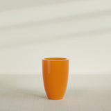 Brannan Tapered Round Planter in Gloss Tangerine, 24"D × 35"H, shown empty