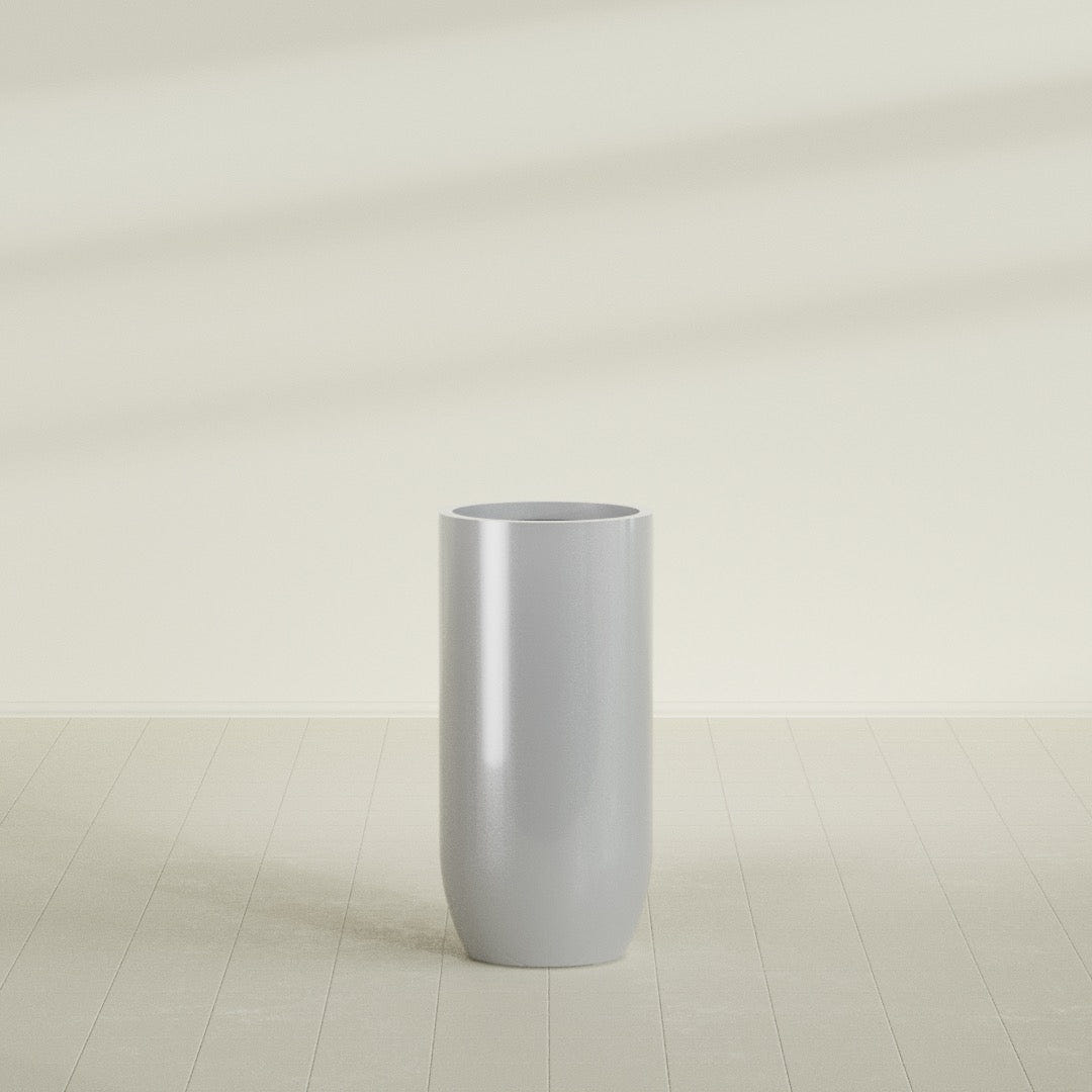 Saint Tropez Bullet Round Planter in Metallic Silver, 24"D × 50"H, shown empty
