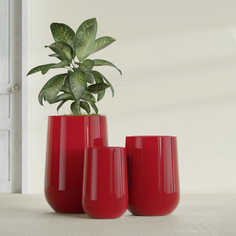 Hayden Urn fiberglass planter in Gloss Red, size range, in a sunlit interior