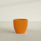 Wannsee Round Planter in Gloss Tangerine, 33"D × 29"H, shown empty