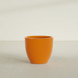 Wannsee Round Planter in Gloss Tangerine, 33"D × 29"H, shown empty