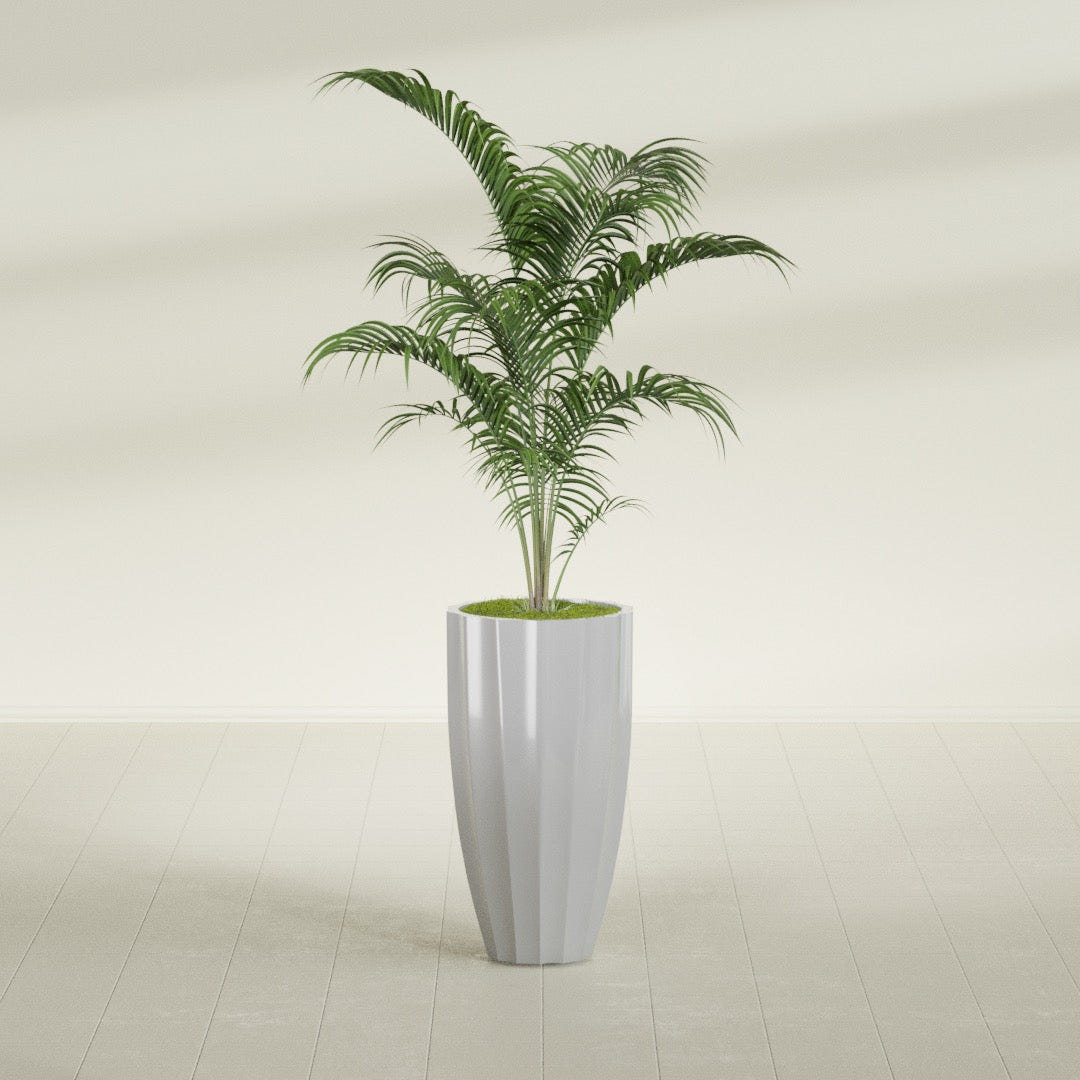 San Jose Tall Fluted fiberglass planter in Metallic Silver, shown planted, in a sunlit interior