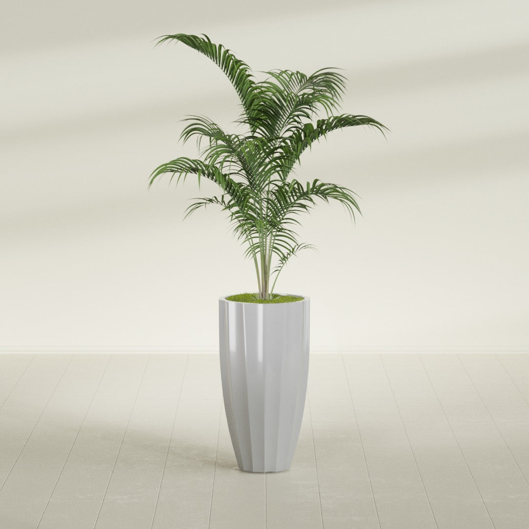 San Jose Tall Fluted fiberglass planter in Metallic Silver, shown planted, in a sunlit interior