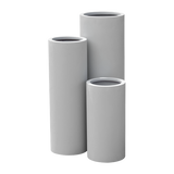 Corry cylinder fiberglass planter shown in all sizes side by side in a studio render for comparing sizes: D 10 in × 20 in, D 10 in × 30 in, D 12 in × 36 in