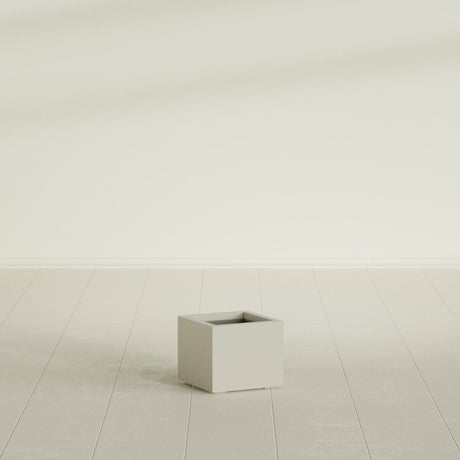 Cuba corner fiberglass planter in Matte Cement Grey (shown in Satin Beige; color approximate)